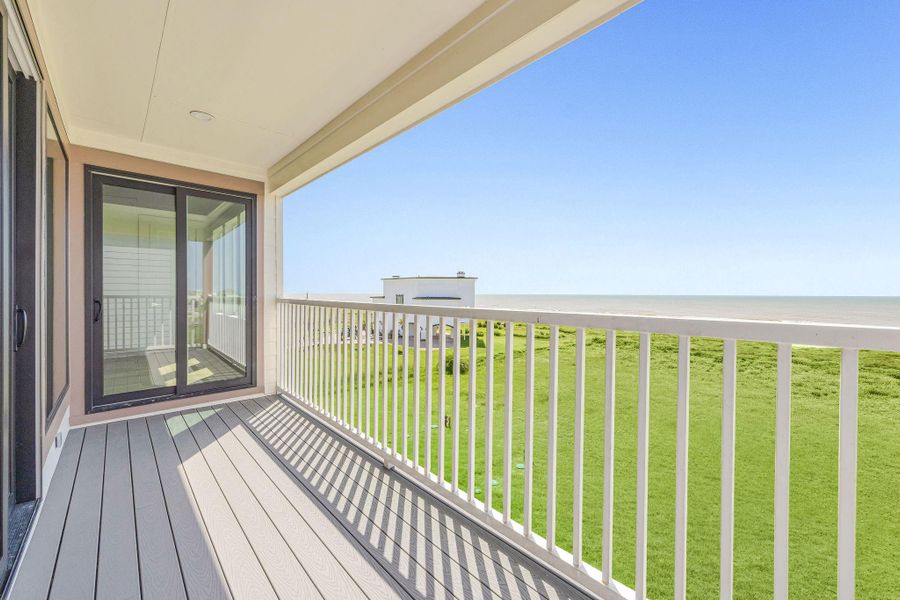 Second floor balcony accessible from family room and secondary bedroom.