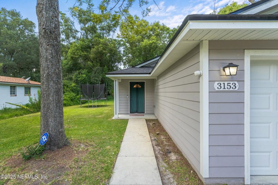 Front exterior of a new home in , Jacksonville, FL, highlighting curb appeal (Image 1).