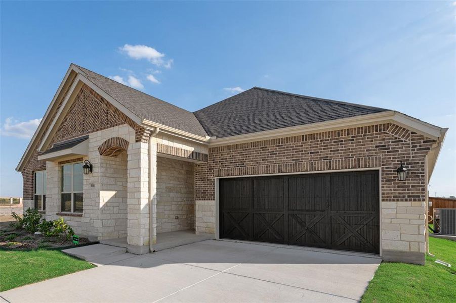 Front exterior of a new home in Arbors at Legacy Hills, Celina, TX, highlighting curb appeal (Image 18).