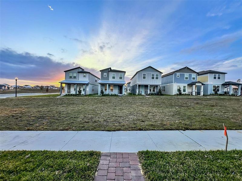 Front exterior of a new home in Silverleaf Reserve Bungalows, Winter Garden, FL, highlighting curb appeal (Image 23).
