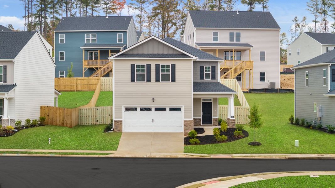 Front exterior of a new home in Southwind Village, Evans, GA, highlighting curb appeal (Image 2).