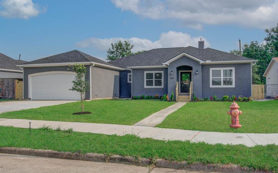 This stucco home is teeming with the latest upgrades