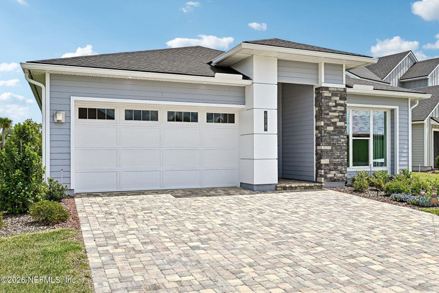 Front exterior of a new home in SilverLeaf, St. Augustine, FL, highlighting curb appeal (Image 31). Front exterior of a new home in SilverLeaf, St. Augustine, FL, highlighting curb appeal (Image 31).