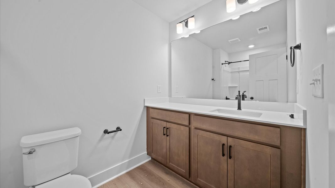 Elegant full bathroom with tasteful finishes and a thoughtfully designed layout