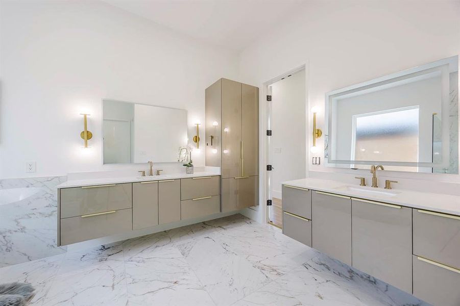 Full bathroom with light marble finish flooring and two vanities Full bathroom with light marble finish flooring and two vanities