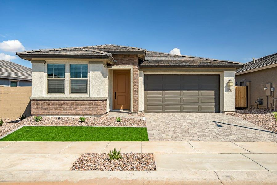 Front exterior of a new home in Mesquite at North Creek, Queen Creek, AZ, highlighting curb appeal (Image 1). Front exterior of a new home in Mesquite at North Creek, Queen Creek, AZ, highlighting curb appeal (Image 1).
