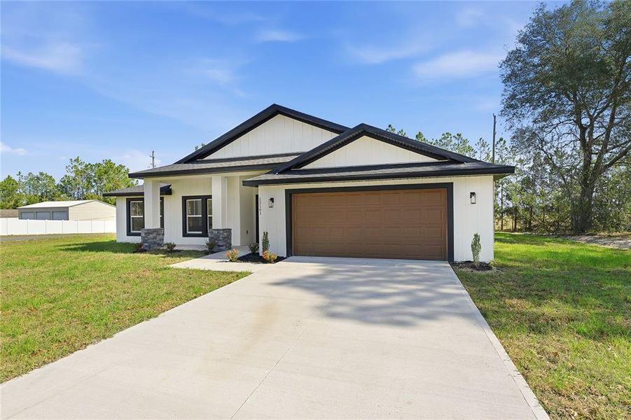 Front exterior of a new home in , Ocala, FL, highlighting curb appeal (Image 22).