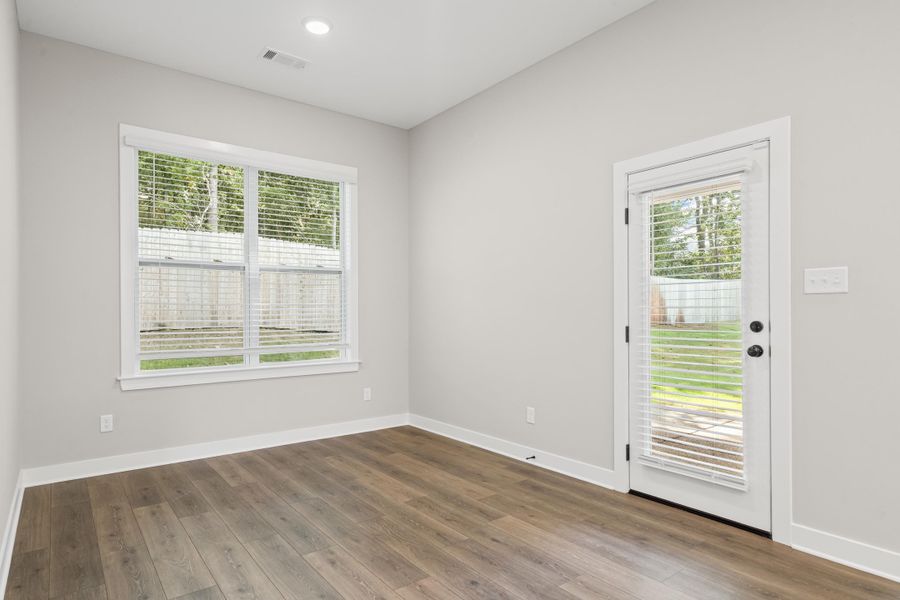 Empty room featuring wood finished floors and recessed lighting