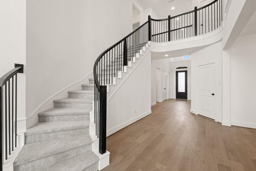 *REPRESENTATIONAL PHOTO* Grand Rounded Staircase With Modern Touches *REPRESENTATIONAL PHOTO* Grand Rounded Staircase With Modern Touches