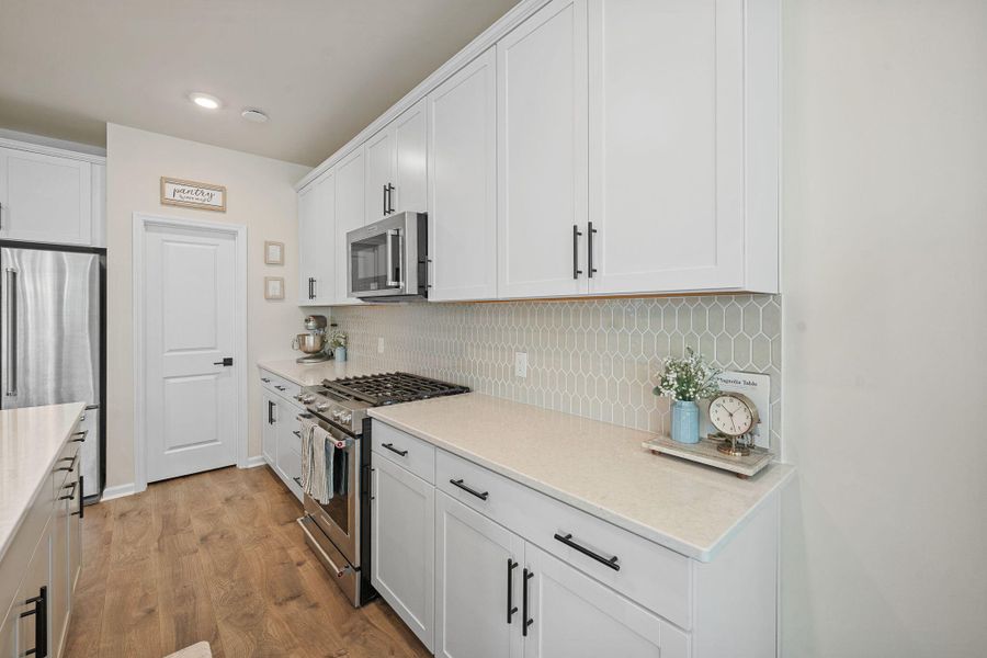 Furnished interior view inside a new home in Jasmine Point at Lakes of Cane Bay, Summerville (Image 7).