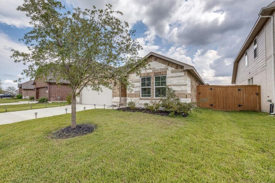 Front exterior of a new home in Sierra Vista, Iowa Colony, TX, highlighting curb appeal (Image 2). Front exterior of a new home in Sierra Vista, Iowa Colony, TX, highlighting curb appeal (Image 2).