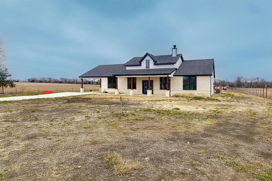 Front exterior of a new home in , Greenville, TX, highlighting curb appeal (Image 25). Front exterior of a new home in , Greenville, TX, highlighting curb appeal (Image 25).