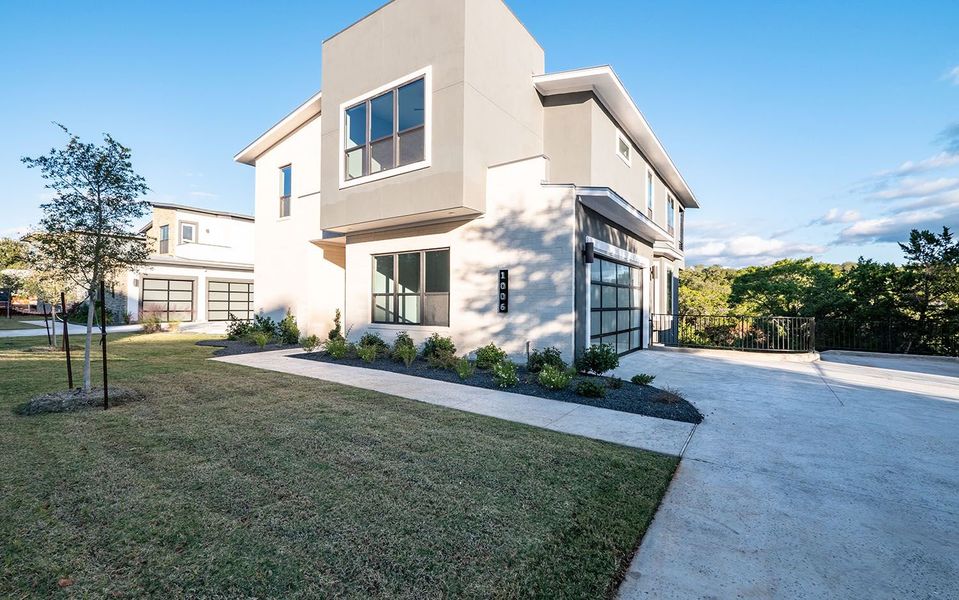 Front exterior of a new home in Preserve at Lakeway, Lakeway, TX, highlighting curb appeal (Image 22). Front exterior of a new home in Preserve at Lakeway, Lakeway, TX, highlighting curb appeal (Image 22).