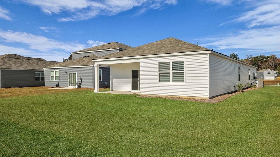Exterior details and patio area of a home in Pine Hills at Cane Bay, Summerville (Image 2).