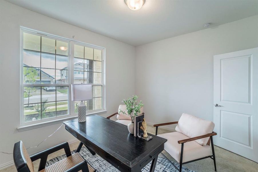 Home office with light colored carpet and baseboards Home office with light colored carpet and baseboards