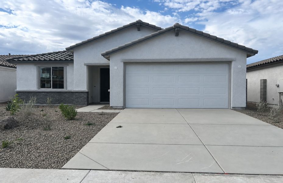Front exterior of a new home in Alamar, Avondale, AZ, highlighting curb appeal (Image 2). Front exterior of a new home in Alamar, Avondale, AZ, highlighting curb appeal (Image 2).