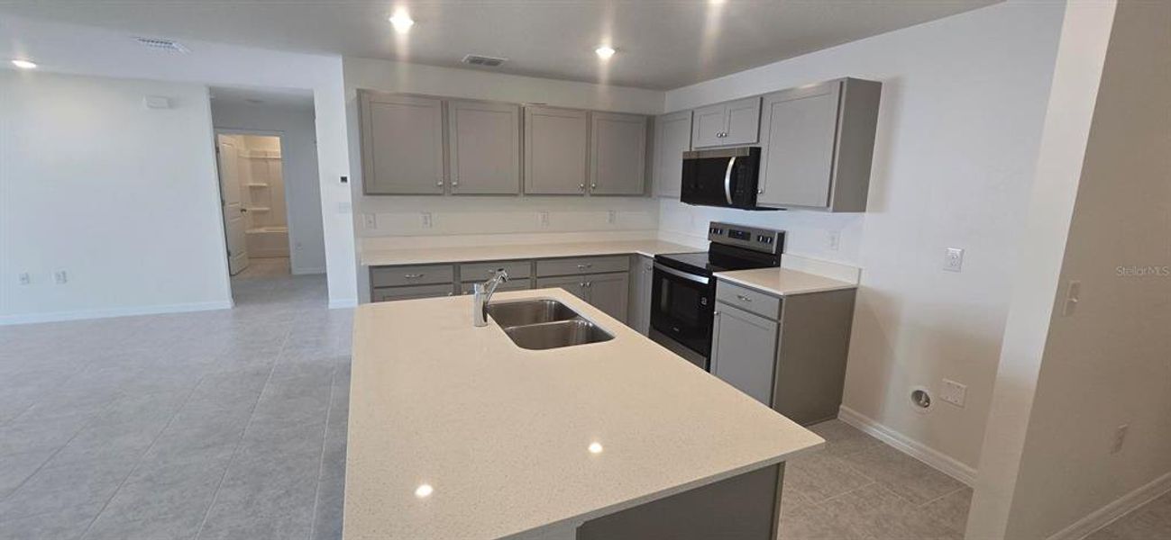 Furnished interior view inside a new home in , Poinciana (Image 5). Furnished interior view inside a new home in , Poinciana (Image 5).