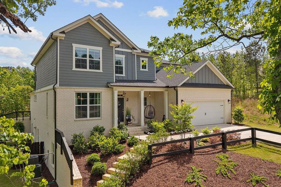 Front exterior of a new home in The Estate at Old Friendship, Buford, GA, highlighting curb appeal (Image 28). Front exterior of a new home in The Estate at Old Friendship, Buford, GA, highlighting curb appeal (Image 28).