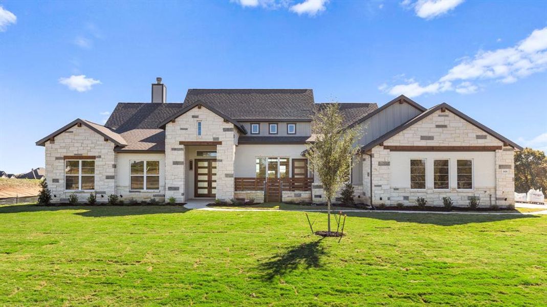 Rear view of property featuring a yard