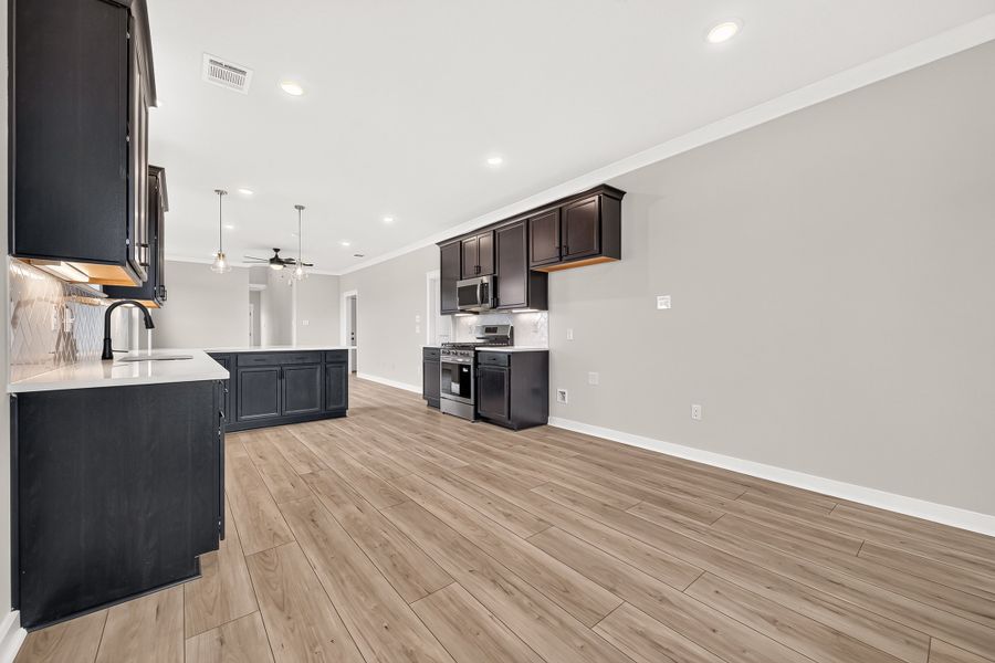 Furnished interior view inside a new home in Aldeana, Bonney (Image 14).