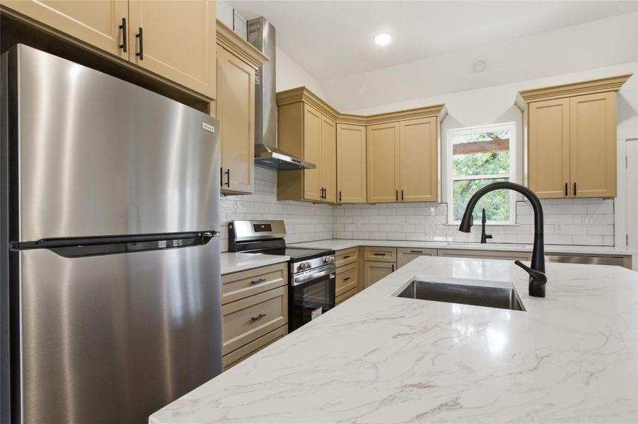 Culinary delights await in this bright kitchen with modern appliances and generous counter space. Culinary delights await in this bright kitchen with modern appliances and generous counter space.
