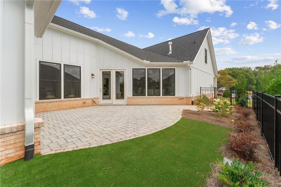 Exterior details and patio area of a home in The Courtyards of Franklin Goldmine, Cumming (Image 22).