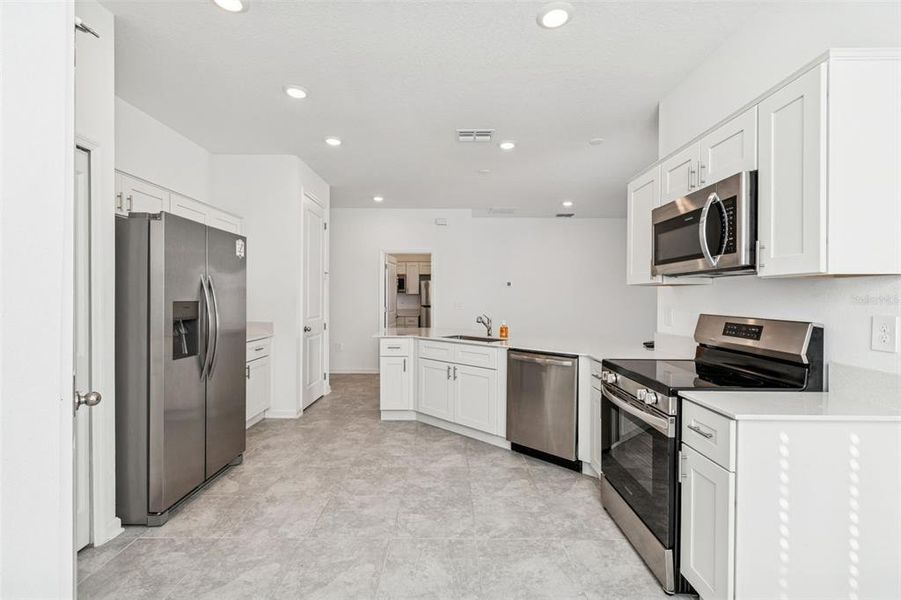 Furnished interior view inside a new home in Ranches at Lake McLeod, Eagle Lake (Image 19).
