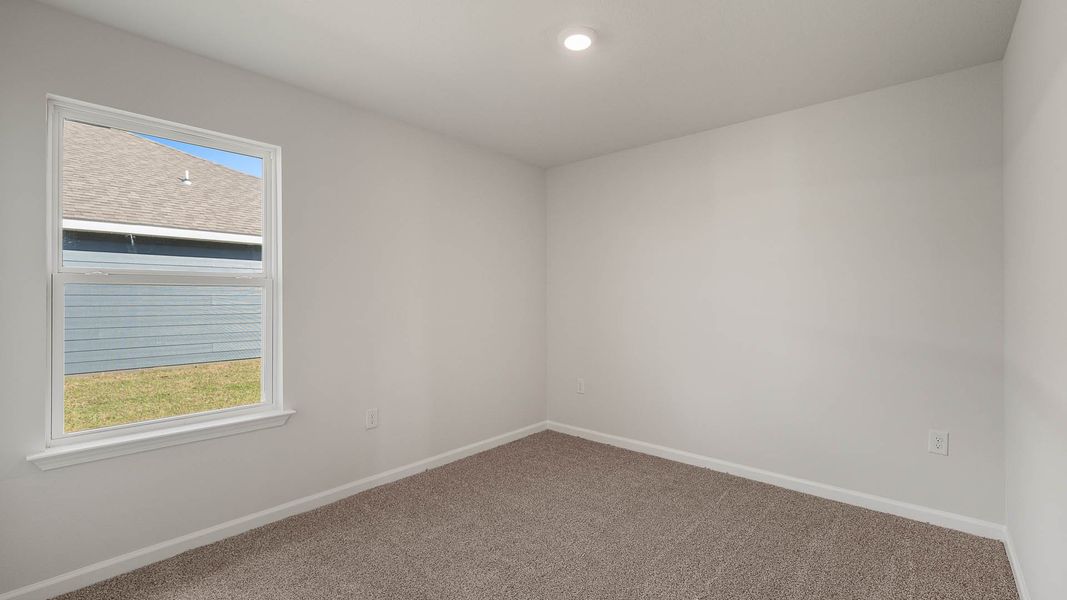 Spacious, unfurnished interior of a new home in Magnolia at the Bluffs Phase 3, Freeport (Image 19).