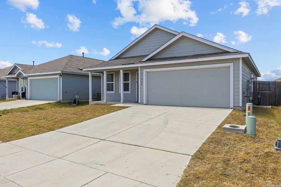 Front exterior of a new home in Hidden Trails, Bulverde, TX, highlighting curb appeal (Image 17).