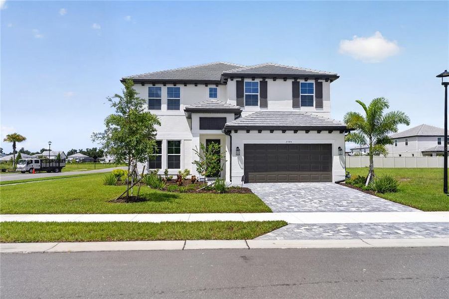 Front exterior of a new home in , Sarasota, FL, highlighting curb appeal (Image 28).