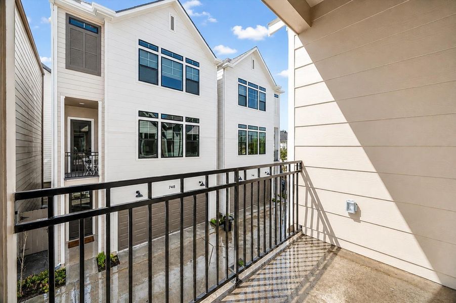 Covered balcony with elevated views of the community streetscape
