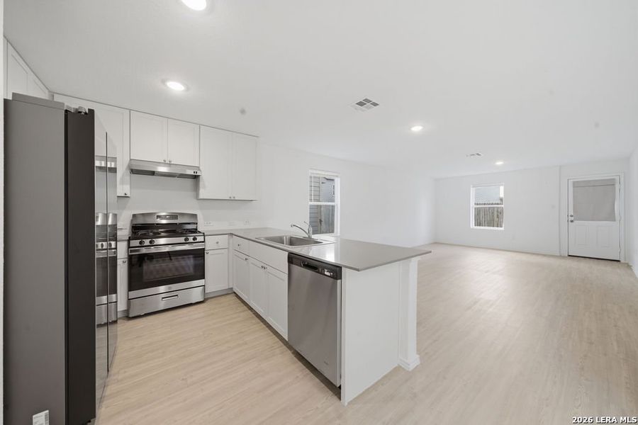 Furnished interior view inside a new home in Aston Park, San Antonio (Image 12).
