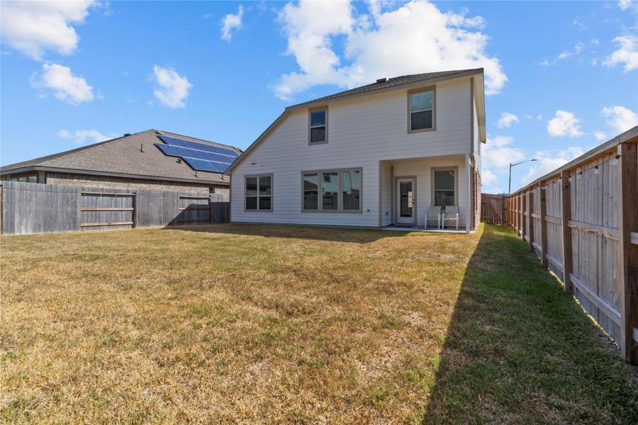 Exterior details and patio area of a home in Tavola: Wildflower II Collection, New Caney (Image 1).