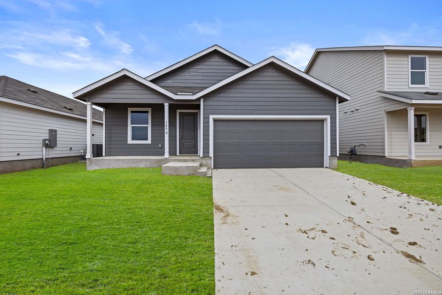 Front exterior of a new home in Voss Farms, New Braunfels, TX, highlighting curb appeal (Image 1). Front exterior of a new home in Voss Farms, New Braunfels, TX, highlighting curb appeal (Image 1).