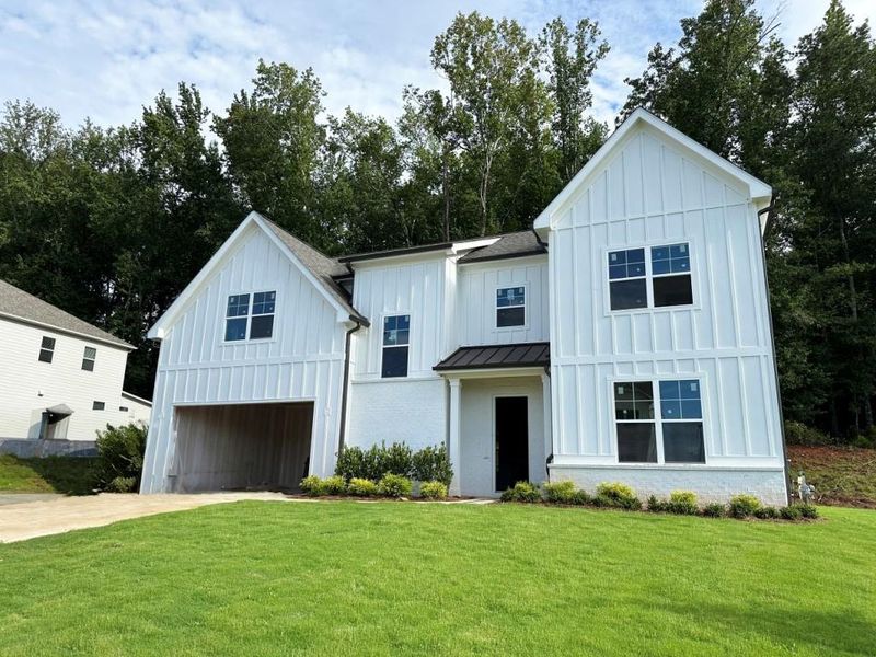Front exterior of a new home in , Canton, GA, highlighting curb appeal (Image 1).