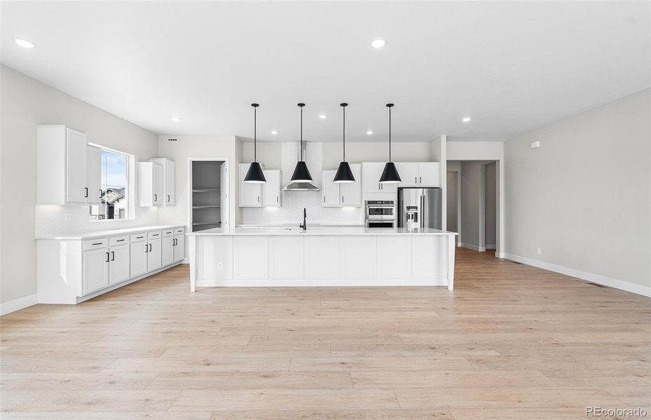 Furnished interior view inside a new home in Hilltop at Inspiration, Aurora (Image 7).