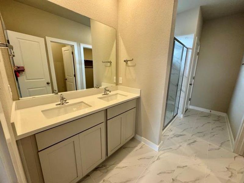 Dual vanities & walk-in shower in Primary Bath