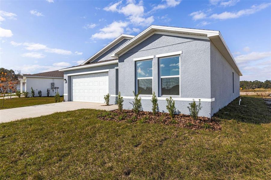 Front exterior of a new home in West Oak, Ocala, FL, highlighting curb appeal (Image 7).