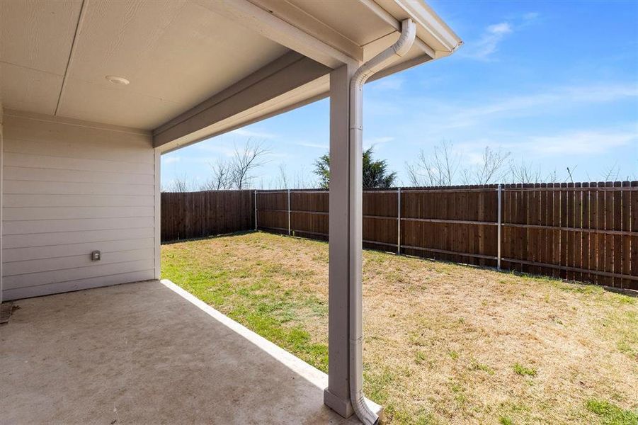 Fenced backyard with a patio Fenced backyard with a patio