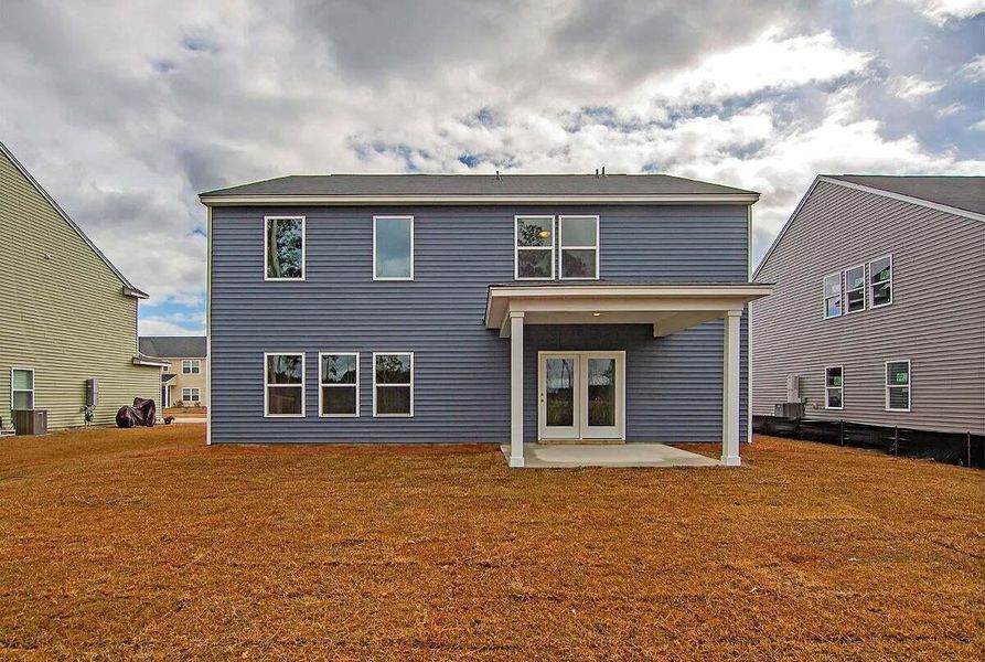 Exterior details and patio area of a home in Tea Farm: Presidents Series, Ravenel (Image 2).