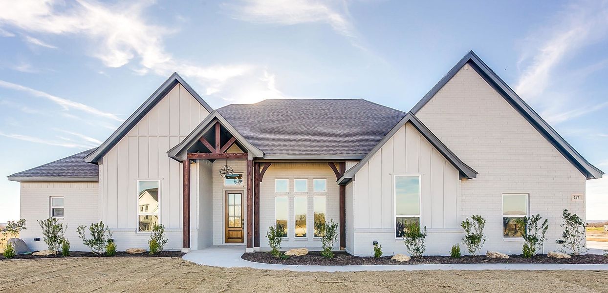 Representative exterior photo of a completed home built from the 100-2466-0718 by Abba River Homes in Stanford Estates, Springtown, TX (Image 2).
