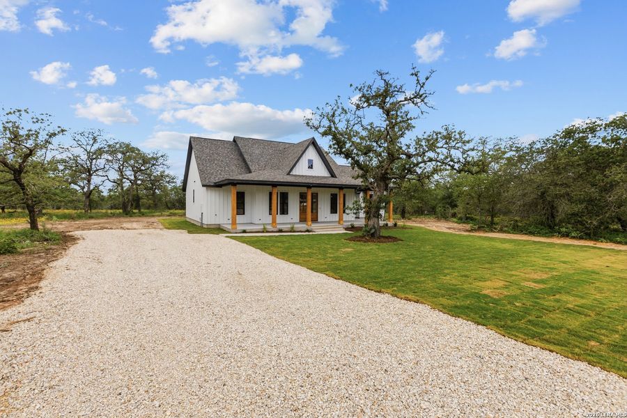 Front exterior of a new home in , La Vernia, TX, highlighting curb appeal (Image 1). Front exterior of a new home in , La Vernia, TX, highlighting curb appeal (Image 1).