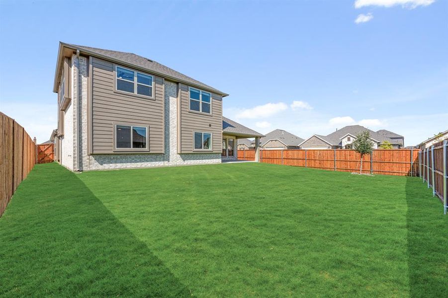 Exterior details and patio area of a home in Timberbrook 3B-4A, Justin (Image 4).