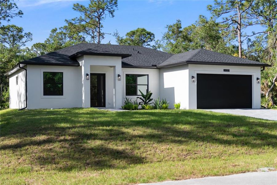 Front exterior of a new home in , Port Charlotte, FL, highlighting curb appeal (Image 22).