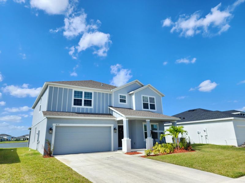 Front exterior of a new home in , Port St. Lucie, FL, highlighting curb appeal (Image 23). Front exterior of a new home in , Port St. Lucie, FL, highlighting curb appeal (Image 23).