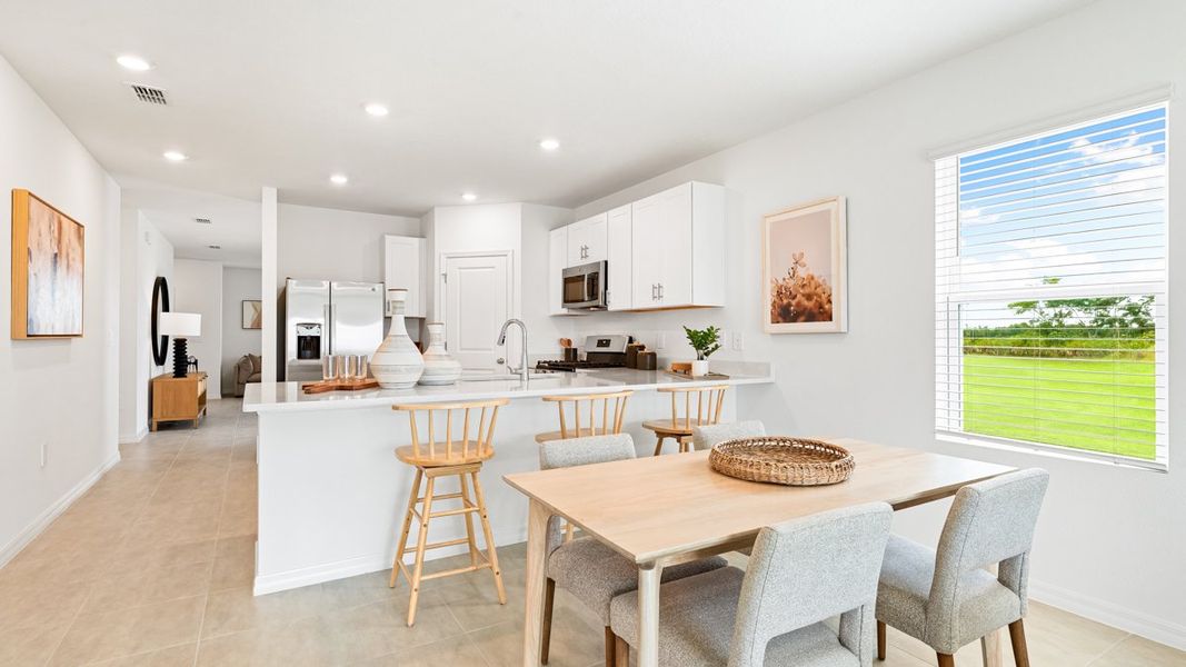 Representative furnished interior of a home built from the Seneca by Taylor Morrison in Palm Wind, Hudson (Image 7).
