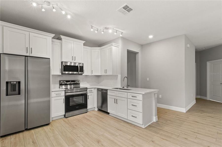 Furnished interior view inside a new home in , Apopka (Image 3).