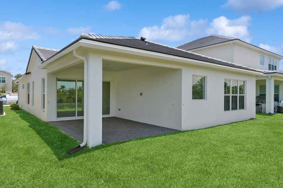 Front exterior of a new home in Salerno Reserve - Single Family, Stuart, FL, highlighting curb appeal (Image 25). Front exterior of a new home in Salerno Reserve - Single Family, Stuart, FL, highlighting curb appeal (Image 25).