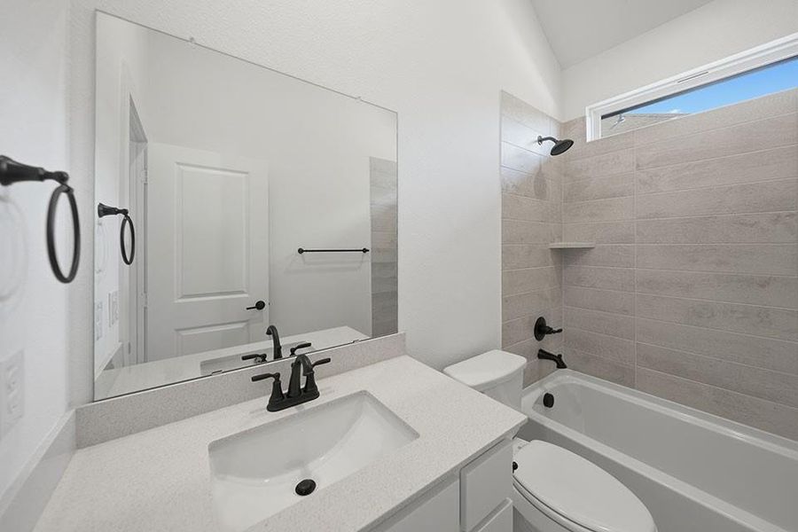 Furnished interior view inside a new home in Light Farms Brenham - 40' Lots, Celina (Image 12).
