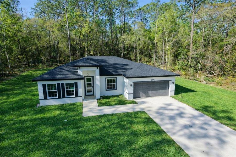 Front exterior of a new home in , Citrus Springs, FL, highlighting curb appeal (Image 20). Front exterior of a new home in , Citrus Springs, FL, highlighting curb appeal (Image 20).